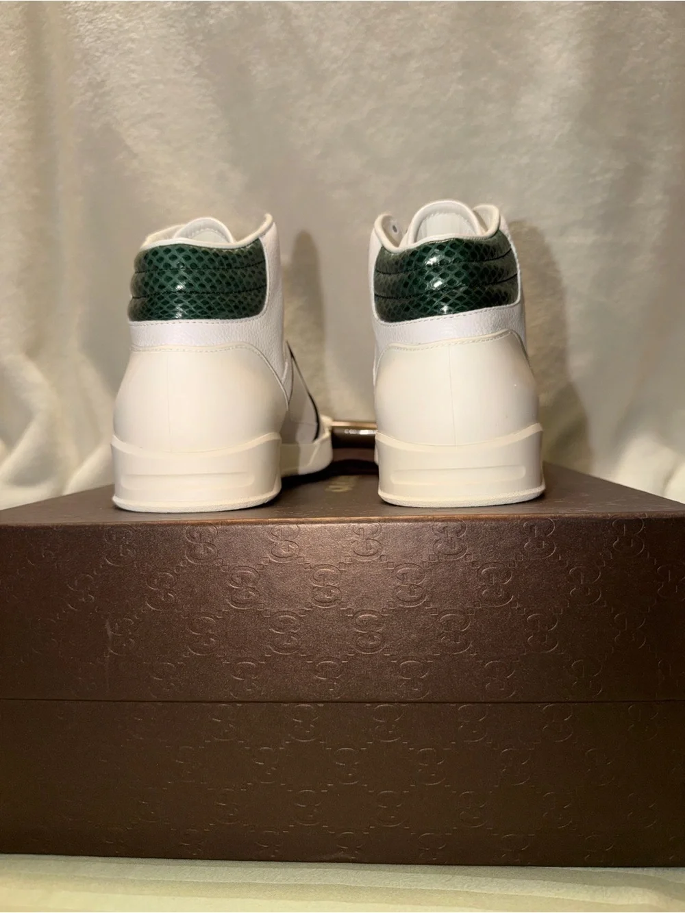 Gucci White Leather Low-Top Sneakers with Red Logo Sole.